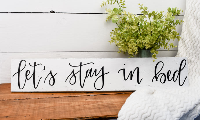 let's stay in bed - handlettered wood sign