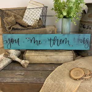 you + me + them = us :: handlettered wood sign